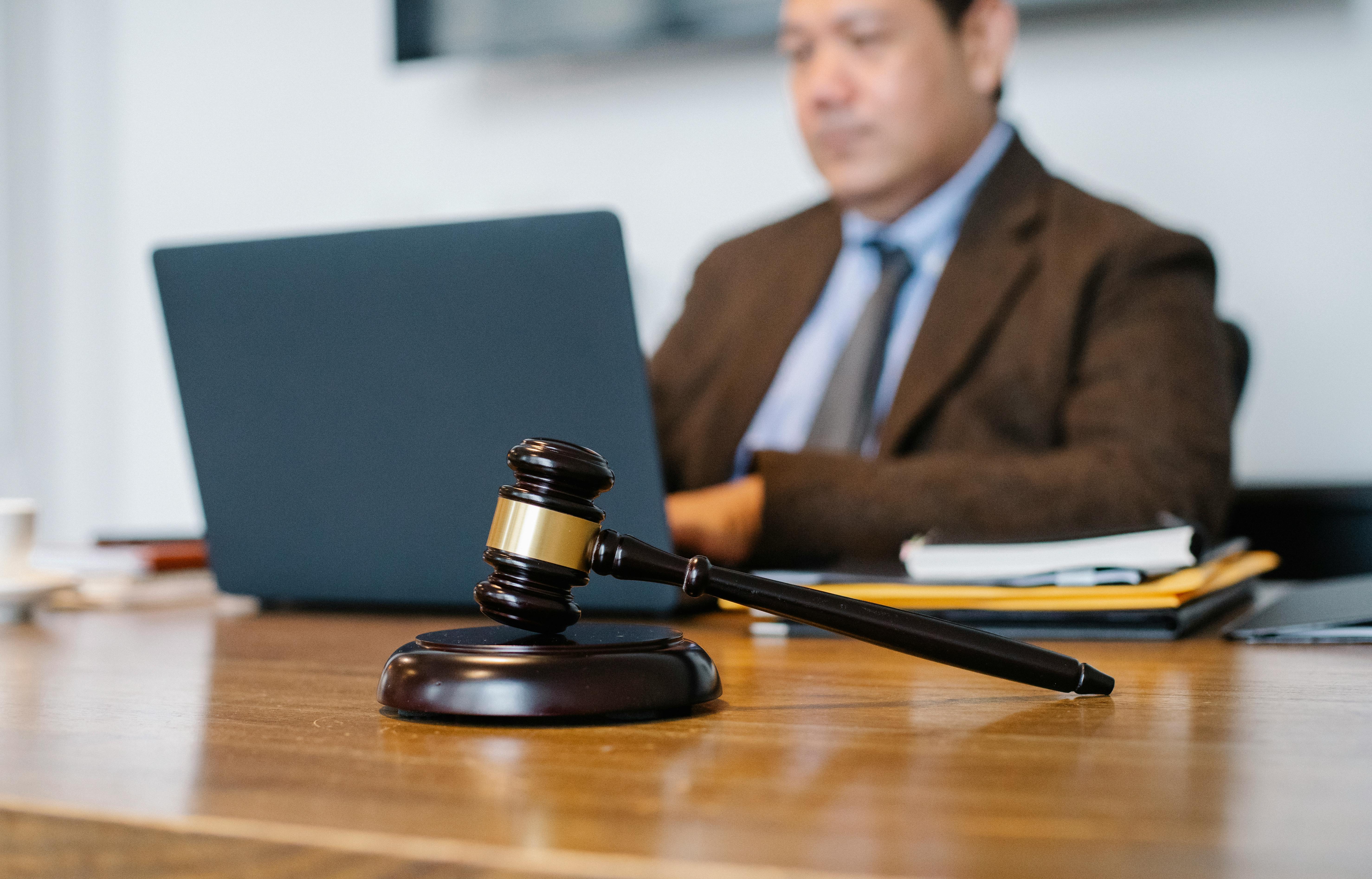 A man writing policy for his law firm's cloud services. 